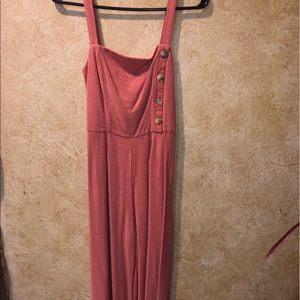 Salmon romper with buttons and waist tie.